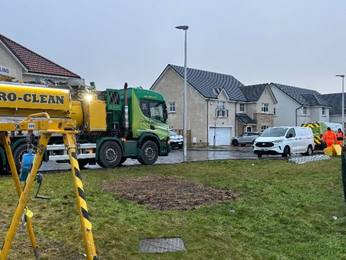 Aqua‑Tech service team, tanker, and lifting tripod onsite responding to persistent wastewater pumping station failures.